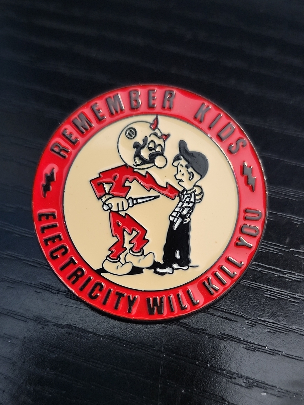 Reddy Kilowatt Remember Kids Red & Cream Safety Enamel Pin